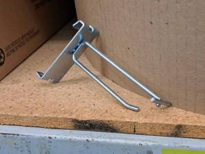 lot 450 image: Lot of (50) 4 Grid Wall Peg Hooks