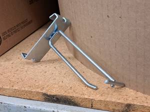 lot 451 image: Lot of (50) 4 Grid Wall Peg Hooks
