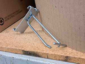 lot 452 image: Lot of (50) 4 Grid Wall Peg Hooks