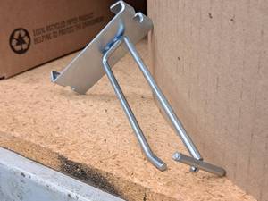 lot 455 image: Lot of (50) 4 Grid Wall Peg Hooks