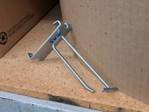 lot 456 image: Lot of (50) 4 Grid Wall Peg Hooks