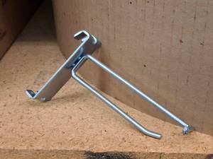 lot 458 image: Lot of (50) 4 Grid Wall Peg Hooks