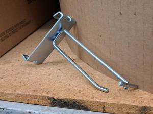 lot 460 image: Lot of (100) 4 Grid Wall Peg Hooks