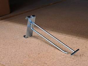 lot 478 image: Lot of (100) 6 Grid Wall Peg Hooks