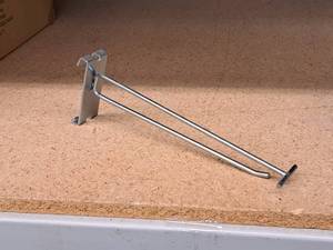 lot 496 image: Lot of (100) 8 Grid Wall Peg Hooks