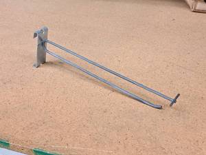 lot 515 image: Lot of (100) 11 Grid Wall Peg Hooks