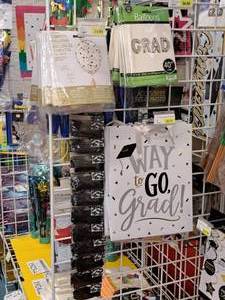 lot 1914 image: Assorted Graduation Party Supplies - Balloons, Gift Bags, Confetti