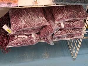 lot 2111 image: Lot of (9 Bags) Burgundy Metallic Mardi Gras Beads 120-count