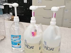 lot 2416 image: (2) 12 Bottles of Balloon Treatment, (1) 12 Bottle Hand Sanitizer