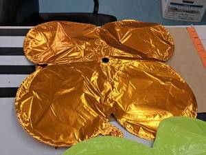 lot 2598 image: Lot of (27) Orange Foil Balloon Quad Balloons 12x12