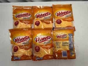 lot 293 image: G. 6x 8oz Velveeta Shreds-Cheddar Flavor