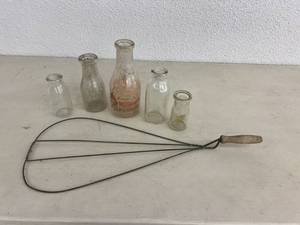 lot 18 image: Vintage Rug Beater & Milk Bottles