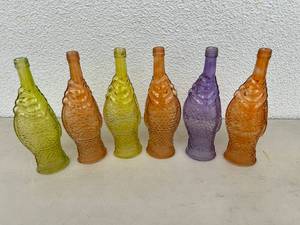 lot 83 image: Colorful Fish Shaped Glass Bottles