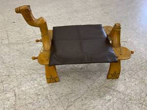 lot 154 image: Vintage Carved Egyptian Wood Camel Saddle Foot Stool Ottoman