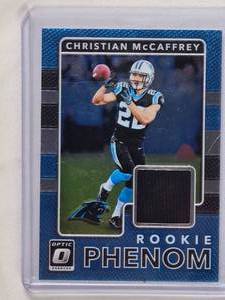 lot 152 image: Christian McCaffrey Rookie Phenom Relic 2017 Panini Donruss Optic No. 5
