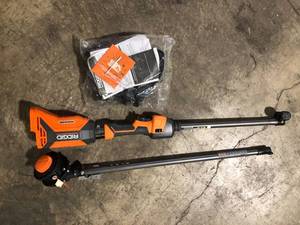 lot 49 image: RIDGID 18V Brushless 14 in. Cordless Battery String Trimmer (Tool Only)   Customer Returns See Pictures