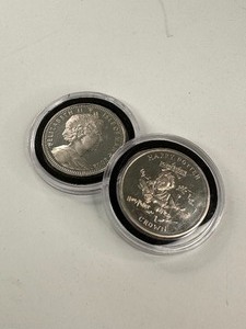 lot 32 image: 2x Harry Potter 1 Crown Issues
