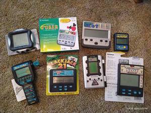 lot 48 image: (8) Handheld Electronic Games - Cards, Fishing, Etc.