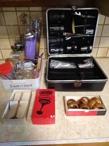 lot 243 image: Drink Mixing Lot- Shot Glasses, Napkin Holders, Cork Screws