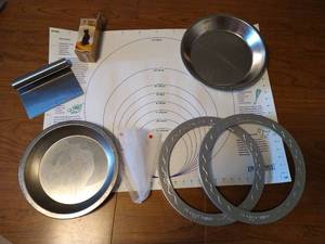 lot 270 image: Pie Maker Lot- Pastry Mat, Crust Guards, Pie Pans, Pie Bird