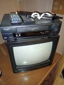 lot 698 image: Small Tv, Sharp VCR w Two Remotes & Antenna
