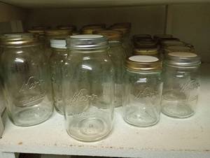lot 733 image: Half Shelf of Quart & Pint Regular Mouth Jars w Varying Lids