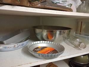 lot 744 image: Shelf of Baking Supplies- Pearlized Loaf Pan, Stainless Bowl, Vintage Glass Rolling Pin, Pie Pans