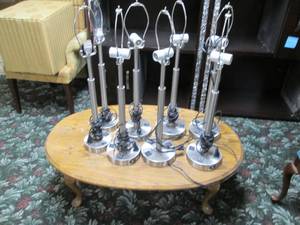 lot 301 image: Low table with 8 metal base lamps...
