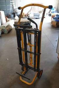 lot 76 image: DeWalt Miter Saw Stand with Wheels DWX276