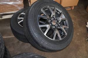 lot 151 image: 2 GMC Envoy 18 Rims with Firestone All Season Tires 23565R18