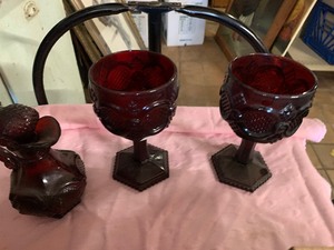 lot 48 image: Red Avon glassware, rug beater and more