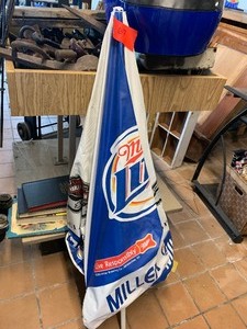 lot 67 image: Miller Lite helmet, umbrella, pumpkin