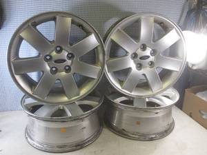lot 244 image: (EC1) Set of 4 Ford 17x7J52 Aluminum Stock Rims