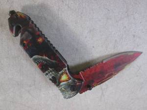 lot 253 image: (CNTR) Skull  Flames Design Spring Assist Folding Knife with Belt Clip - 8 14 Open  4 34 Closed - New In Box