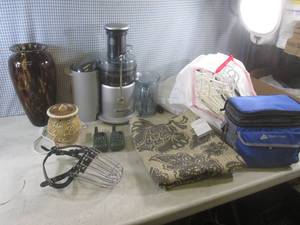 lot 299 image: (BR1) Lot of Misc - Breville Juicer, Pair 2-Way Radios, Wax Warmer, Large Decorative Glass Vase, Dog Muzzle, Accent Rug (New) Insulated Cooler and Bag of Plastic Hangers