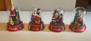 lot 81 image: MAIN - Lot of 4 Coca-Cola Limited Edition Santa Figurines by The Franklin Mint