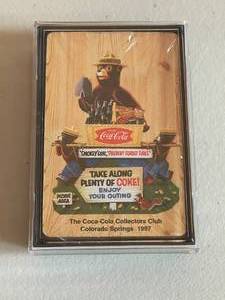 lot 103 image: MAIN - Smokey Bear Coca-Cola Collectors Club Playing Cards - 1997