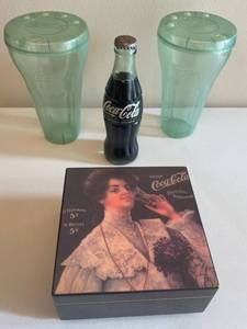 lot 107 image: MAIN - Coca-Cola Memorabilia Lot Glass Bottle, Plastic Tumblers, and Vintage Music Box