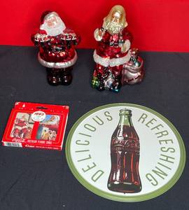 lot 125 image: BASEMENT - Lot of Coca-Cola Collectibles - Nostalgia Playing Cards, Santa Figurines, and Tin Sign