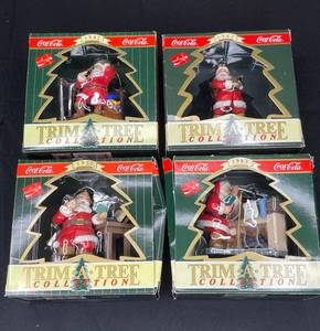 lot 130 image: BASEMENT - Coca-Cola Trim A Tree Collection Santa Ornaments - Lot of 4