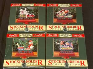 lot 166 image: BASEMENT - Coca-Cola North Pole Bottling Works Express Stocking Holder Collection - Lot of 4