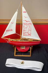 lot 473 image: BASEMENT - Coca-Cola Memorabilia Sailboat Model and Collectors Cap