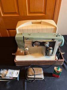 lot 391 image: MAIN - Revere Sewing Machine with Accessories and Carrying Case untested