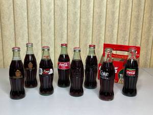 lot 104 image: MAIN - Vintage Coca-Cola Glass Bottles Collectible Lot with Original Packaging