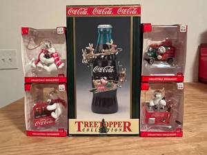 lot 73 image: BASEMENT - Coca-Cola Collectible Christmas Ornaments and Tree Topper Lot