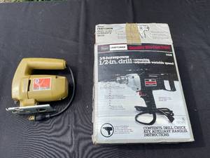 lot 328 image: GARAGE - Craftsman 38-Horsepower 12-in. Drill with Black & Decker Jigsaw