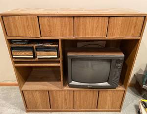 lot 417 image: BASEMENT - Retro Entertainment Center with TV, VHS Tapes, and More