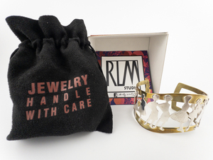 lot 8 image: RLM Studio (Robert Lee Morris) Andy Warhol Foundation Lovely Ladies Silhouettes Open, Free Form Sterling Silver & Brass Cuff Bracelet.