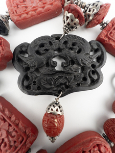 lot 33 image: AMY KAHN RUSSELL Red & Black Cinnabar With Carved Birds & Sterling Silver Accents Statement Necklace.