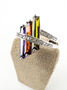 lot 49 image: RS Covenant Purple, Red, & Purple Swarovski Crystal WChannel Set CZ Rhodium Plated Base Metal Fashion Ring. Size 9.5 - 9.75.
